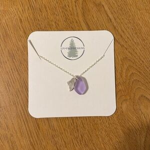 Silver necklace with purple pendant and state of Maine shape